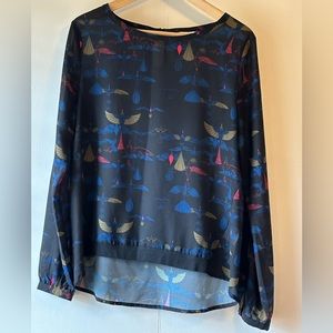 Blouse with an art deco style pattern